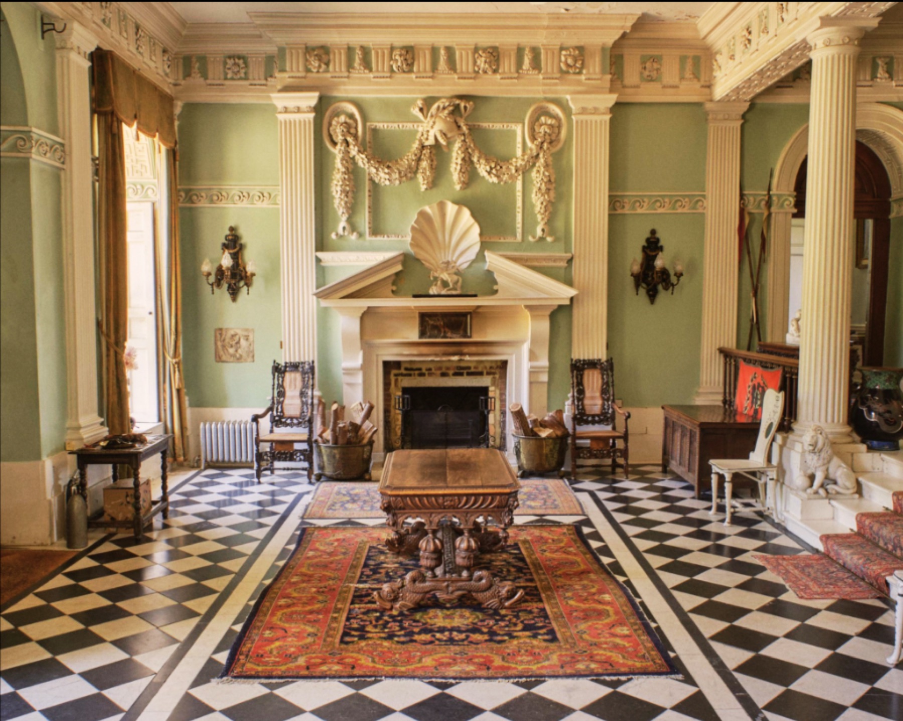 Ornate reception room with a black and white floor