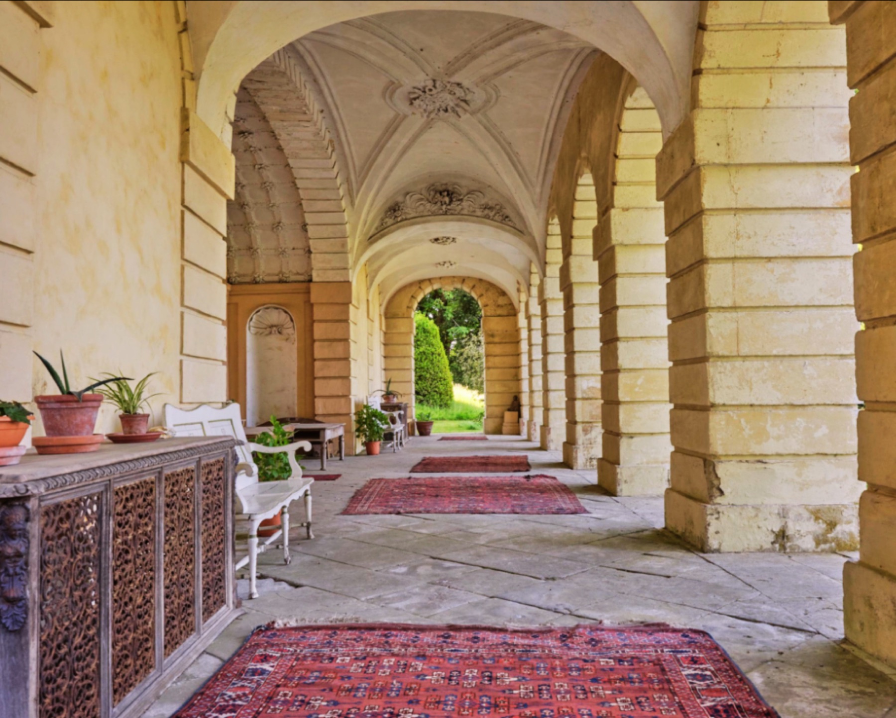 Stone colonnade overlooking a garden