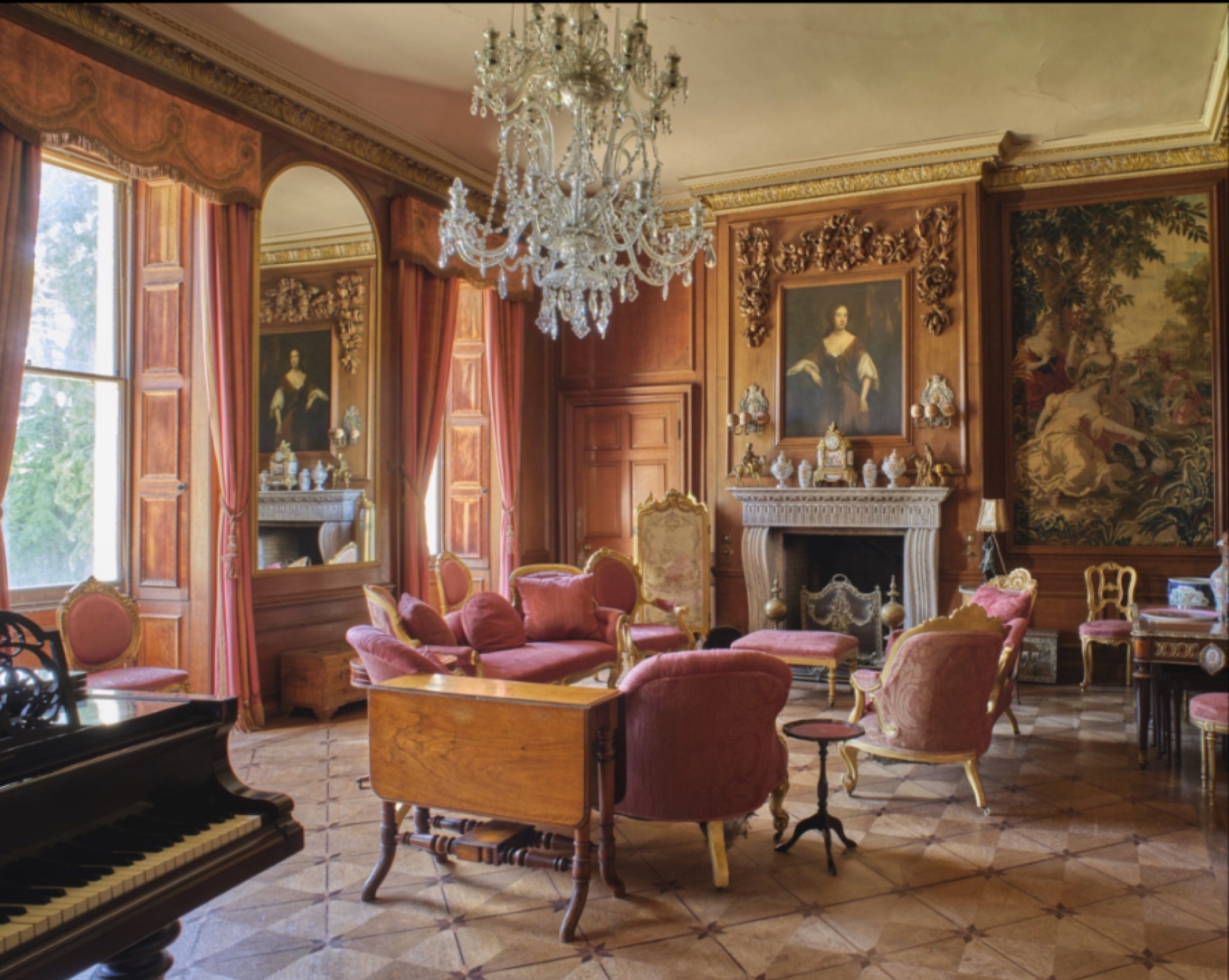 Rose-toned drawing room with chandelier