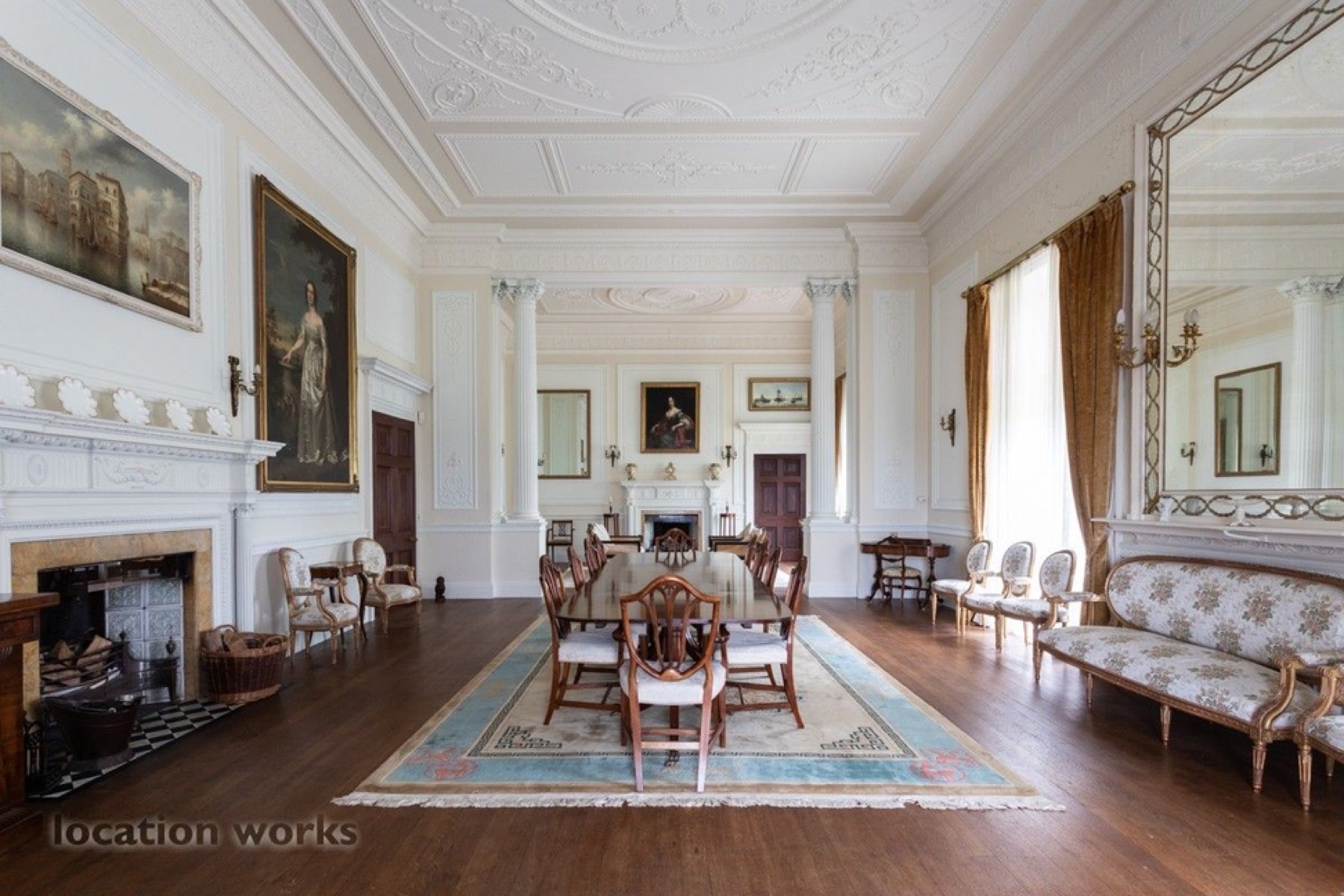 Light formal dining room with white panelled walls