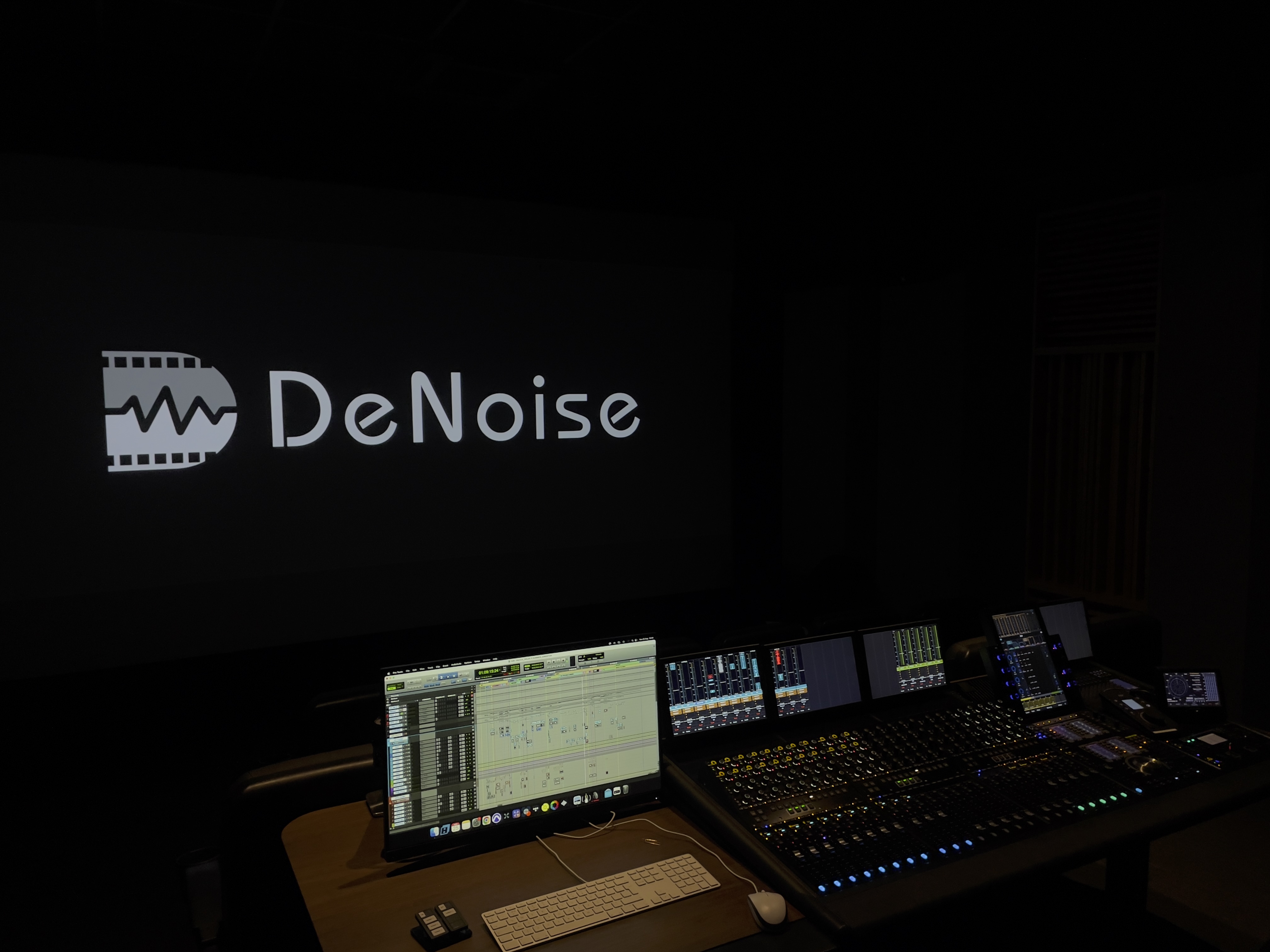 DeNoise post-production studio with an audio mixing console and editing workstation