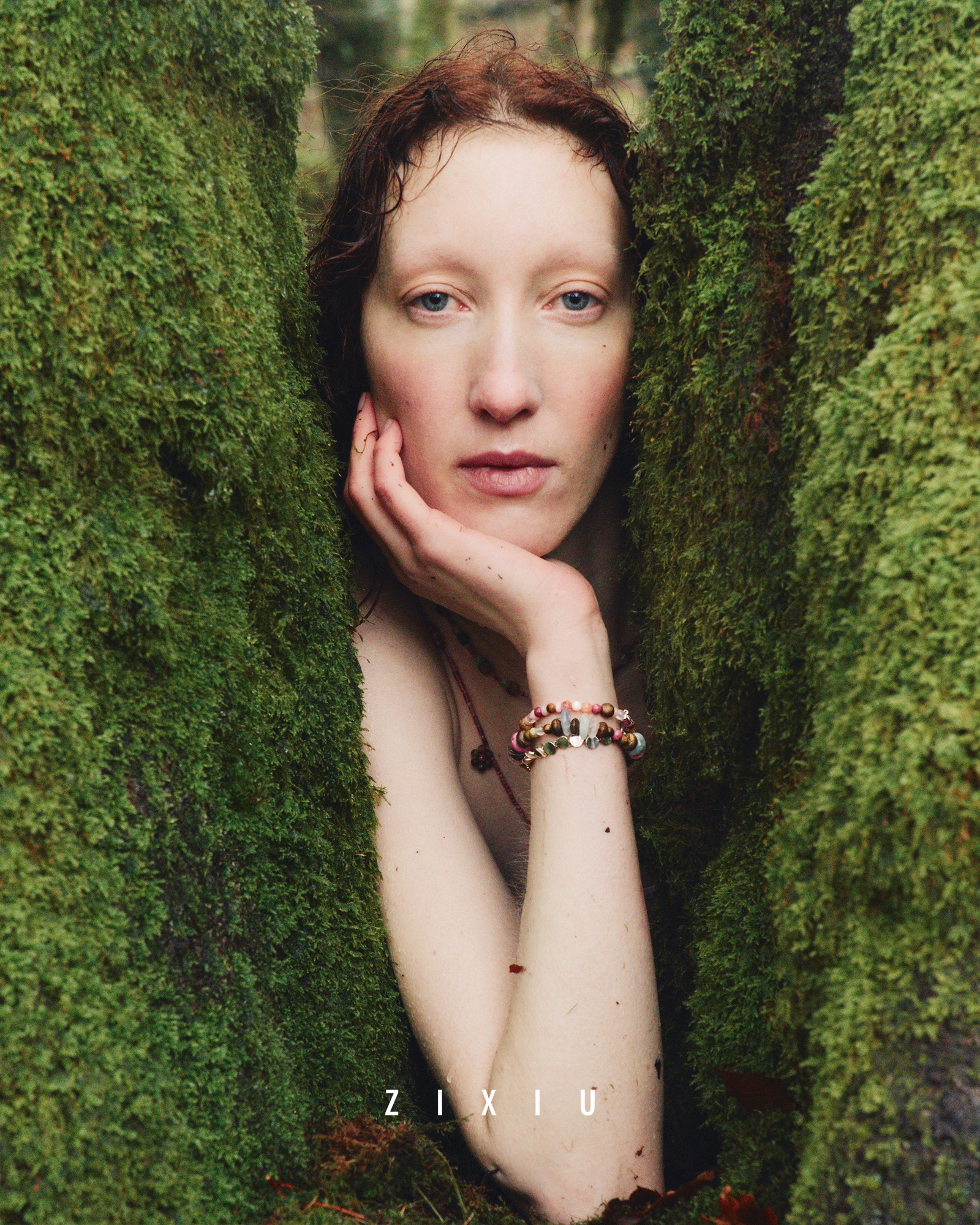 ZIXIU model framed by vivid green moss